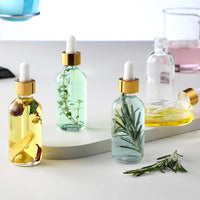 Clear Glass Dropper Bottle – Gold Cap & Travel Friendly